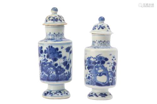 TWO CHINESE BLUE AND WHITE CYLINDRICAL VASES AND COVERS.