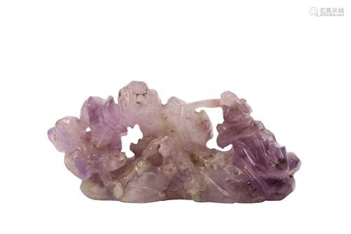 A CHINESE AMETHYST DRAGON AND PHOENIX BRUSH REST.