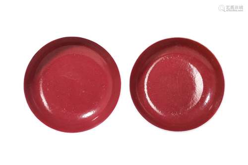 A PAIR OF CHINESE COPPER RED GLAZED DISHES.