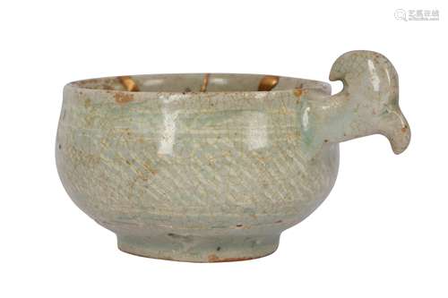 A SMALL KOREAN CELADON HANDLED BOWL.