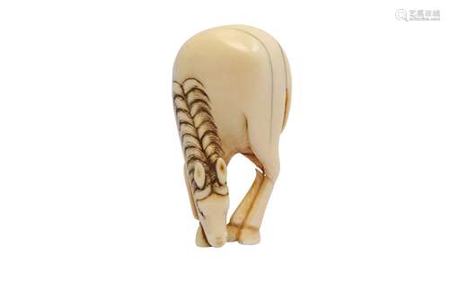 AN IVORY NETSUKE OF A GRAZING HORSE.