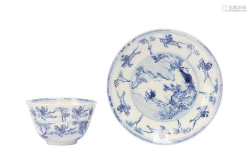 A CHINESE BLUE AND WHITE 'MASTER OF THE ROCKS' CUP AND SAUCE...