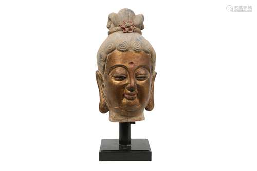 A LARGE CHINESE POLYCHROME AND GILT STUCCO HEAD OF A BUDDHA.