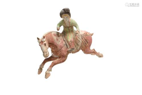 A CHINESE POTTERY FIGURE OF A POLO PLAYER.