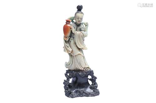 A CHINESE SOAPSTONE FIGURE OF AN IMMORTAL MAIDEN.