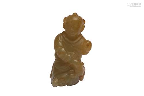 A CHINESE YELLOW JADE CARVING OF A BOY.