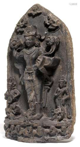 A BLACK STONE STELE OF SURYA.