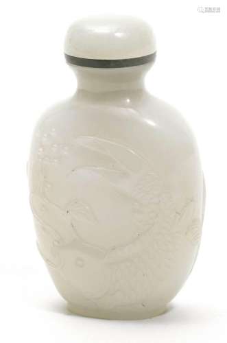 AN OVOID WHITE JADE SNUFF BOTTLE CARVED WITH A CARP.