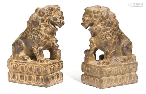 A PAIR OF STONE LIONS.