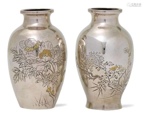 TWO SMALL ENGRAVED SILVER VASES.