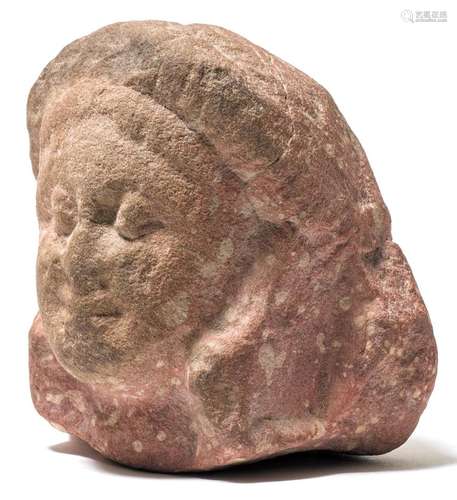 A SMALL MOTTLED RED SANDSTONE HEAD.