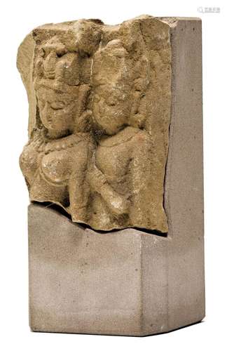 A BUFF SANDSTONE FRAGMENT OF A PAIR OF GODS.