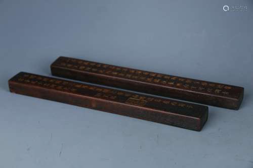A Pair of Red Sandalwood Paperweights
