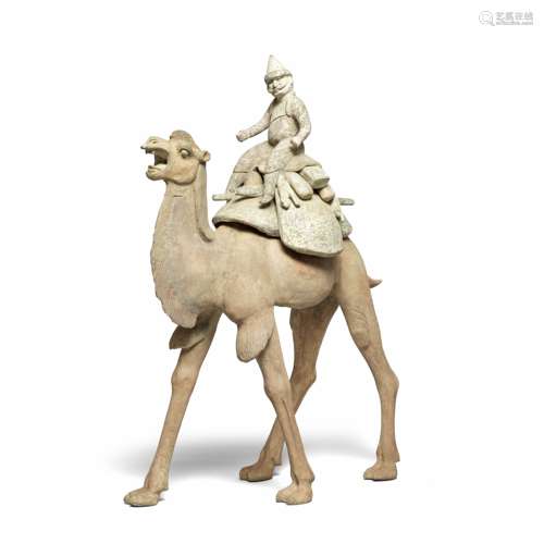 A VERY LARGE POTTERY MODEL OF A CAMEL AND 'FOREIGN' RIDER Ta...