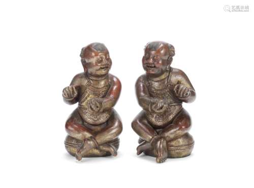 A PAIR OF GILT-LACQUERED WOOD FIGURES OF THE HEHE ERXIAN 19t...