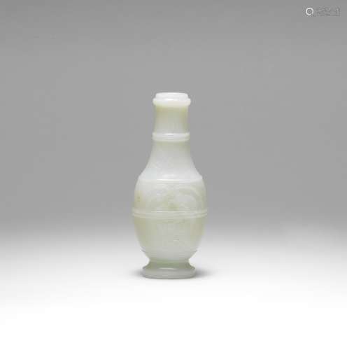 A RARE ARCHAISTIC WHITE AND RUSSET JADE VASE Qianlong