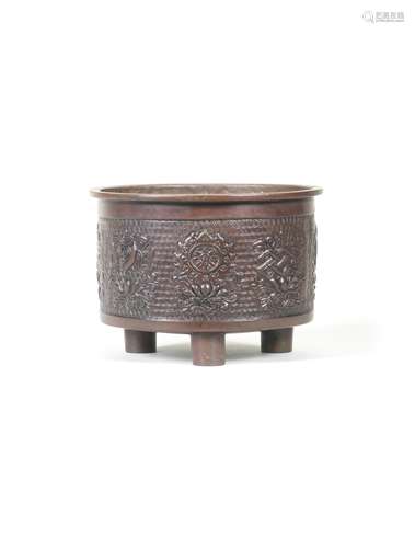 A BRONZE TRIPOD 'EIGHT BUDDHIST EMBLEMS' INCENSE BURNER Xuan...