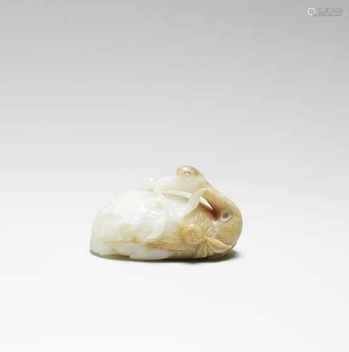 A WHITE AND RUSSET JADE CARVING OF A CRANE 17th century