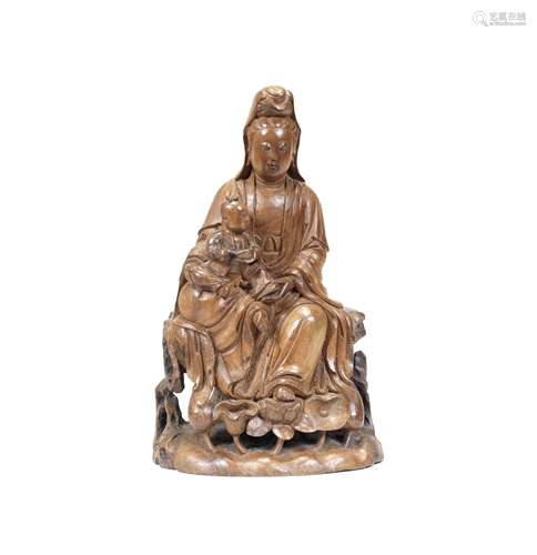 A RARE WOOD GROUP OF GUANYIN AND CHILD 17th/18th century