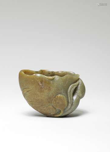 A GREEN AND RUSSET JADE 'LOTUS-LEAF' CUP 17th century