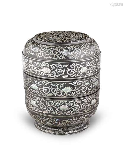 A large mother-of-pearl-inlaid black lacquer two-tiered picn...