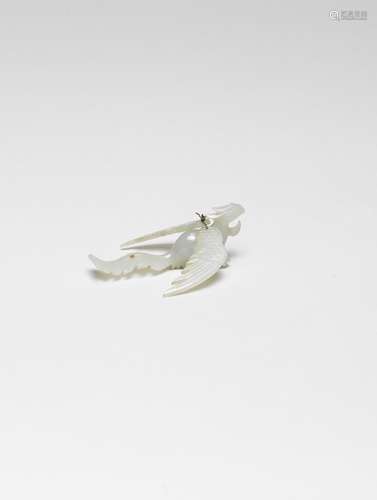 A PALE GREEN JADE ARTICULATED 'PHOENIX' CARVING Ming Dynasty