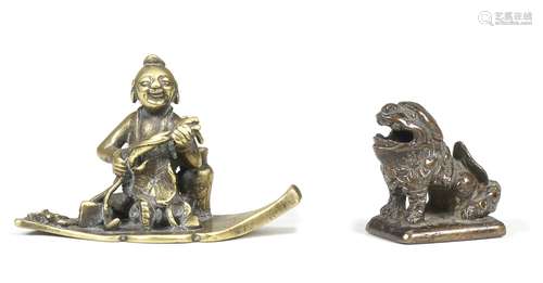 AN UNUSUAL BRONZE 'BOY ON LEAF' JOSS-STICK HOLDER 17th centu...