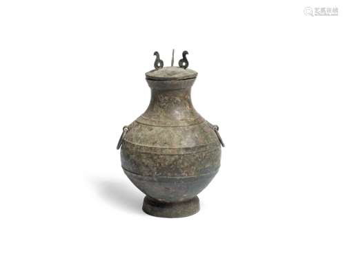 AN ARCHAIC BRONZE RITUAL WINE VESSEL AND COVER, HU Han Dynas...