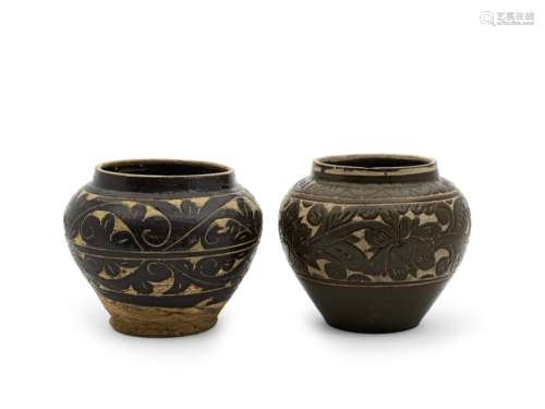 TWO CIZHOU-TYPE BROWN-GLAZED CARVED JARS Yuan/Ming Dynasty (...