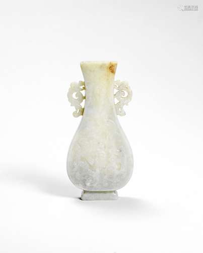 AN ARCHAISTIC PALE GREEN JADE VASE Late Ming Dynasty