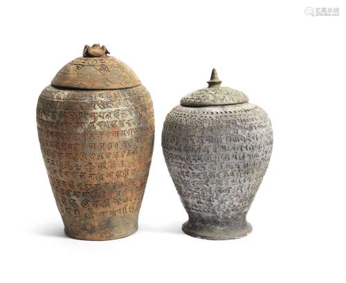 TWO RARE POTTERY 'SANSKRIT' JARS AND COVERS Song/Yuan Dynast...