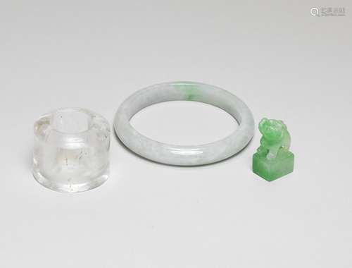 A JADEITE BANGLE, A SEAL AND A ROCK CRYSTAL THUMB RING Qing ...