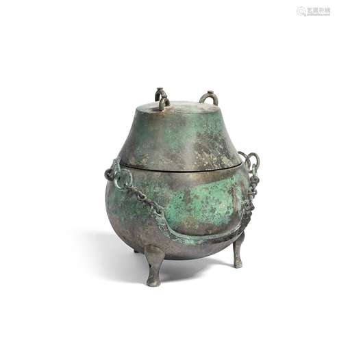 AN ARCHAIC BRONZE RITUAL TRIPOD WINE VESSEL AND COVER, HOULO...