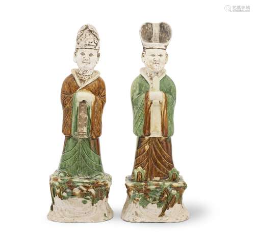 A LARGE PAIR OF SANCAI-GLAZED FIGURES OF OFFICIALS Tang Dyna...