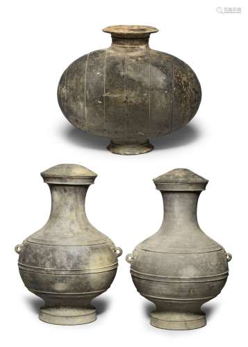 A PAIR OF LARGE GREY POTTERY VASES AND COVERS, HU, AND A POT...