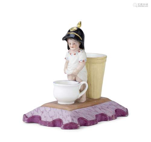 An amusing porcelain figural pencil standGardner Porcelain F...