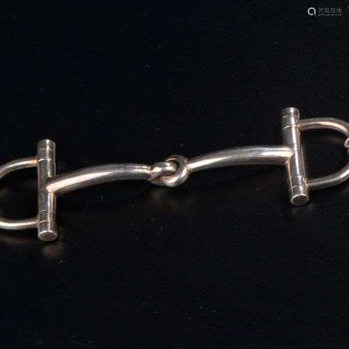 HERMÈS. Bracelet en argent 925 millièmes figurant des mors d...