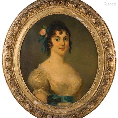ÉCOLE DU XIXe SIECLE Portrait de jeune femme en ovale. Huile...