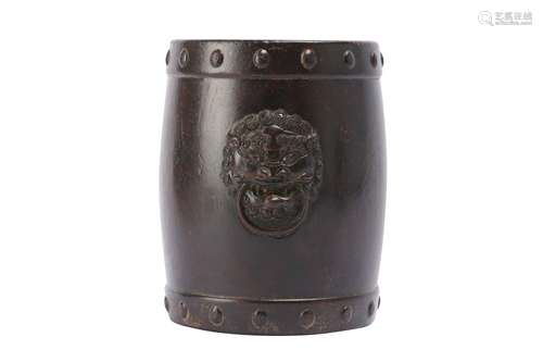 A CHINESE CARVED WOOD LION MASK BRUSH POT.