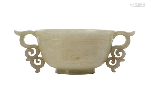 A CHINESE PALE CELADON JADE ARCHAISTIC CUP.