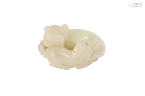 A CHINESE WHITE JADE 'LION DOG' GROUP.