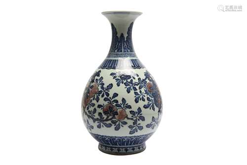 A CHINESE BLUE AND WHITE AND UNDERGLAZE-RED 'FRUIT' VASE, YU...