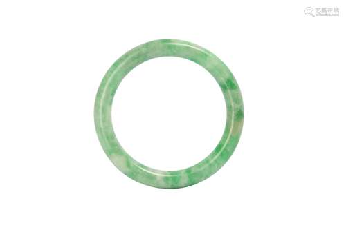 A CHINESE APPLE-GREEN JADEITE BANGLE.