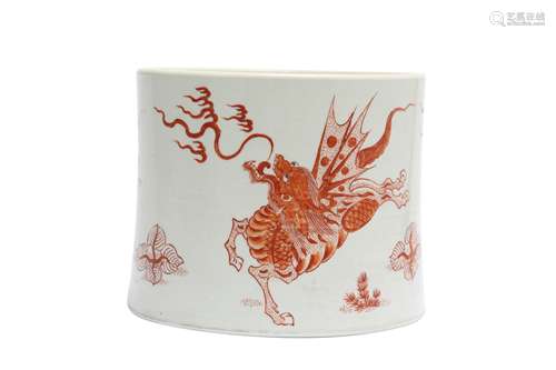 A CHINESE IRON-RED 'MYTHICAL BEAST' BRUSH POT, BITONG.