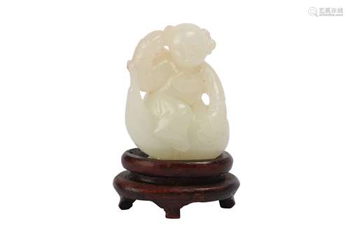 A CHINESE WHITE JADE 'BOY' CARVING.