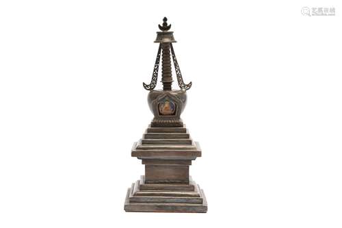 A TIBETAN SILVER STUPA.