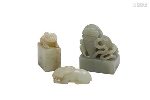 TWO CHINESE PALE CELADON JADE SEALS AND A 'HARE' CARVING.