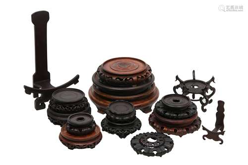 A COLLECTION OF CHINESE WOOD STANDS.