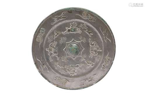 A CHINESE BRONZE SILVERED MIRROR.