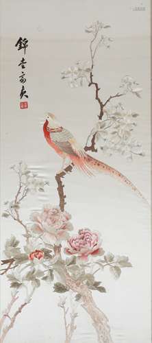 A CHINESE EMBROIDERED SILK PANEL.